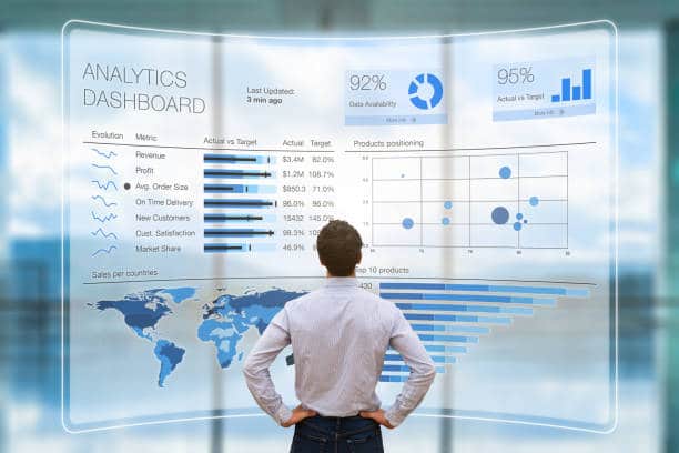 Business Strategy man gazing at data displayed in front of him